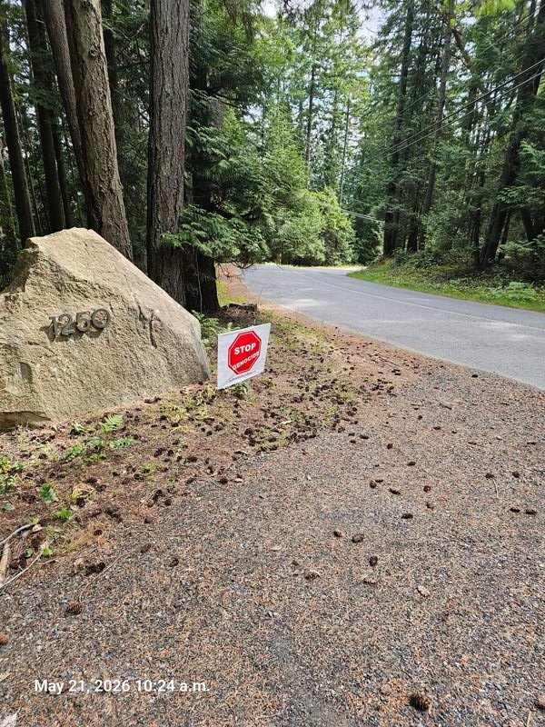 Stop Genocide sign at 1250 Barrett Road, Gabriola