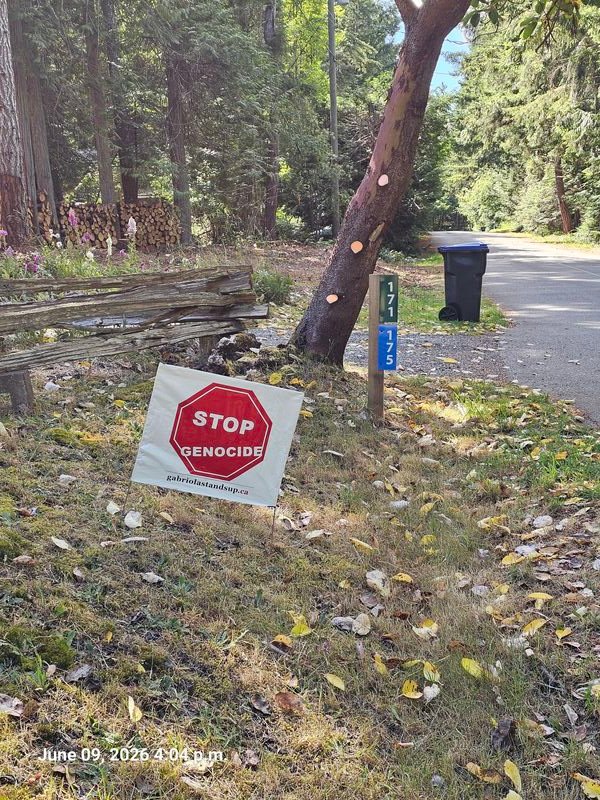 Stop Genocide sign at 175 Malaspina Drive, Gabriola