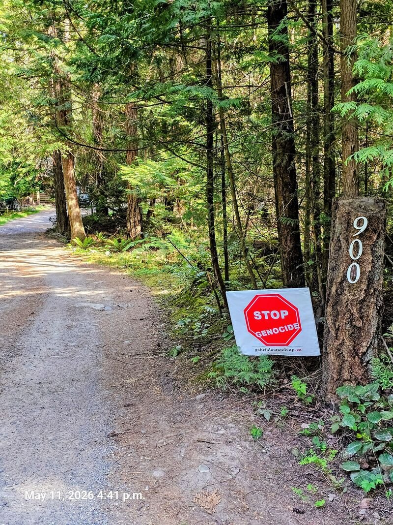 Stop Genocide sign at 900 Bertha Road, Gabriola