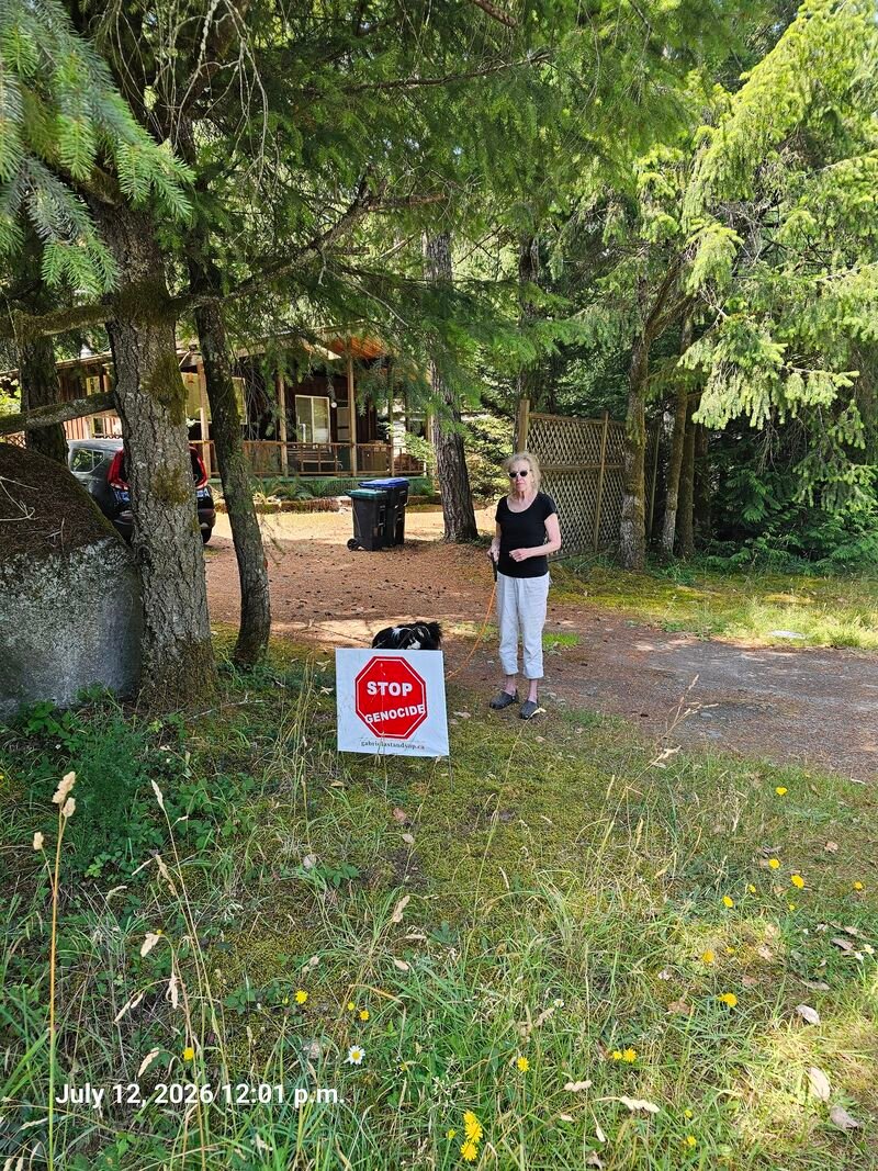Anne's Stop Genocide sign on Malaspina Drive, Gabriola