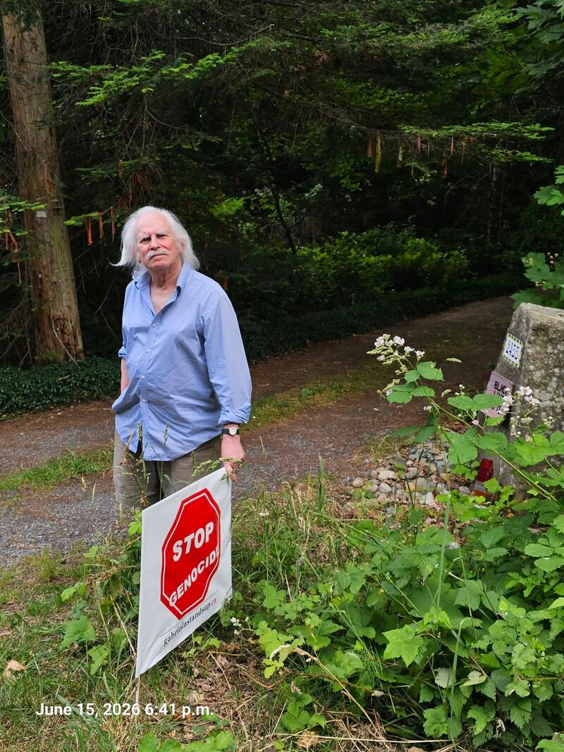 Bob with his Stop Genocide sign on Islands View Drive, Gabriola