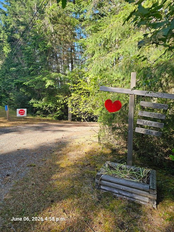 Stop Genocide sign on Eva Road, Gabriola