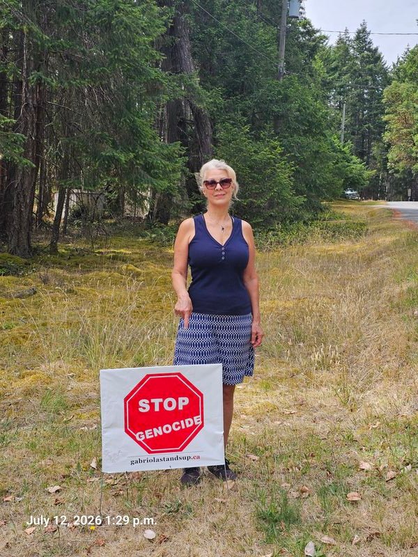 Geanine's Stop Genocide sign on Commodore Way, Gabriola - sign #100