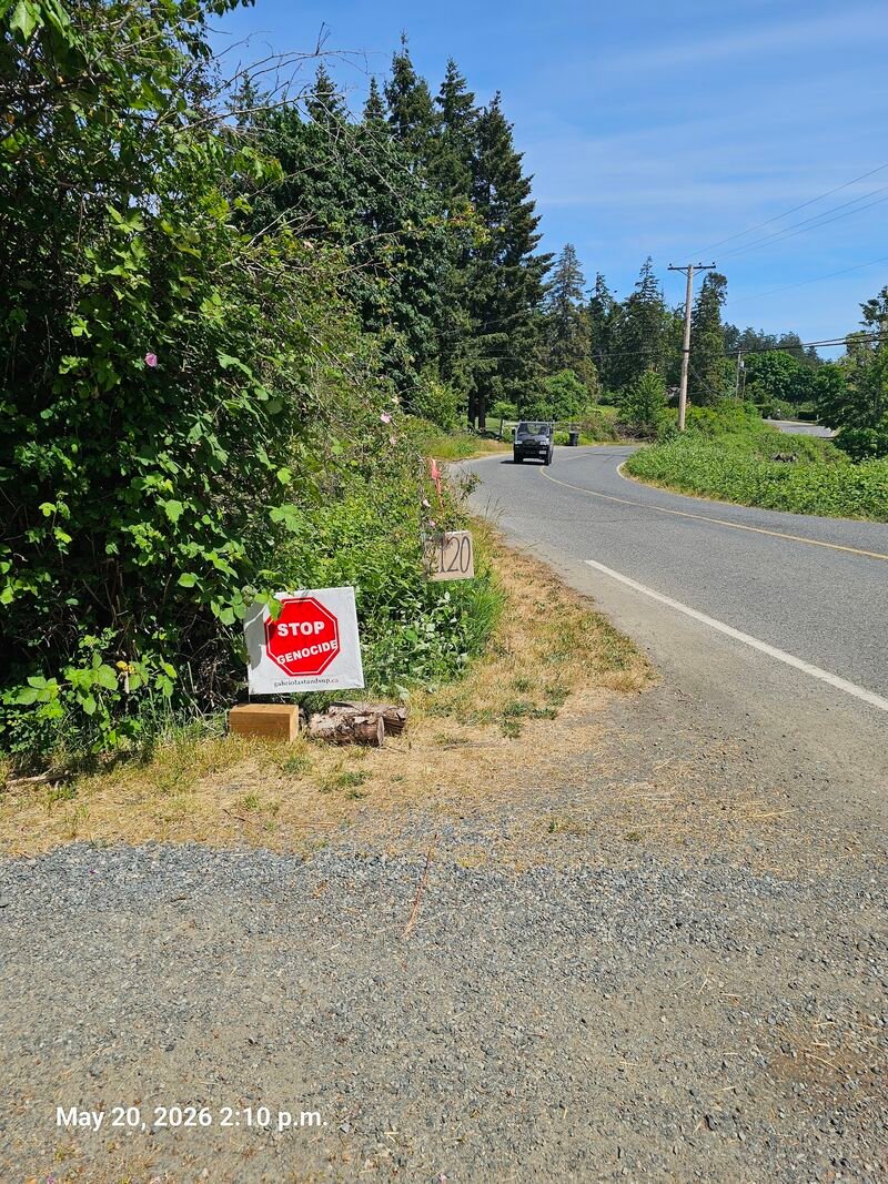 Jennifer's Stop Genocide sign on South Road, Gabriola