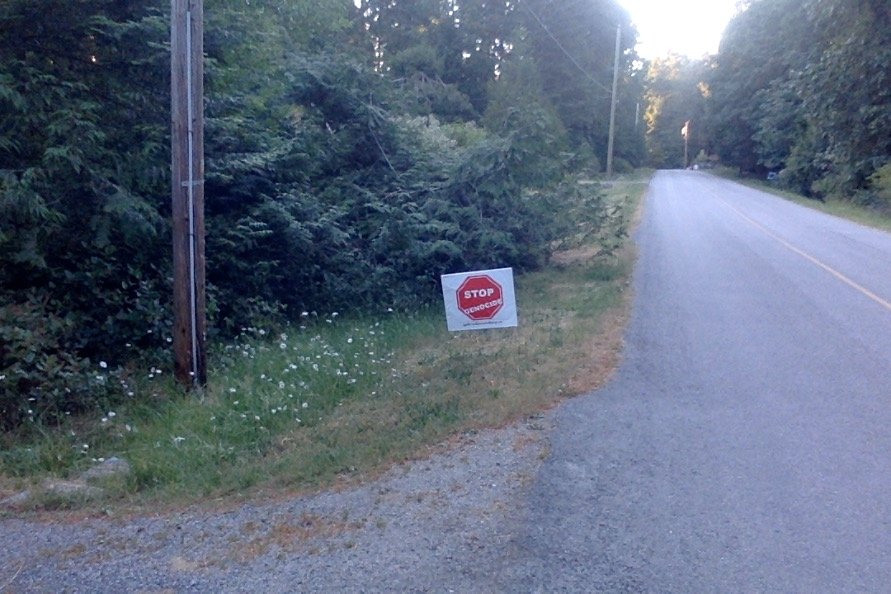 Joy's Stop Genocide sign on Harrison Way, Gabriola