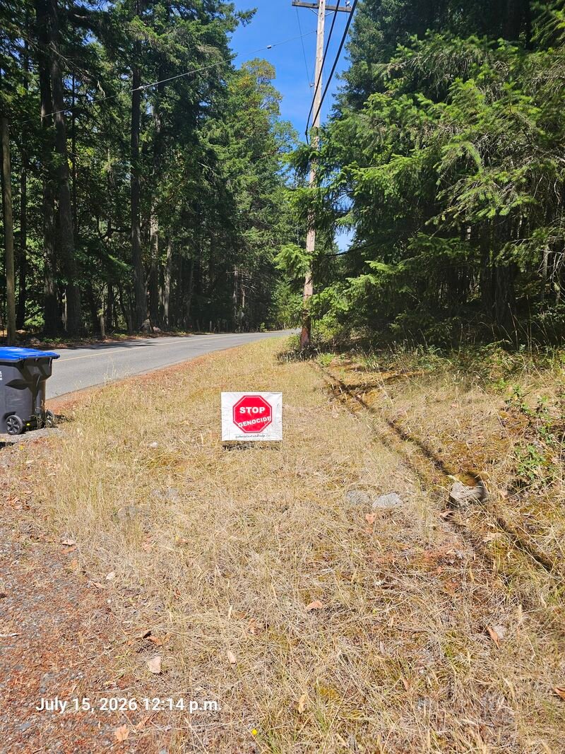 Julia's Stop Genocide sign on South Road, Gabriola - sign #103