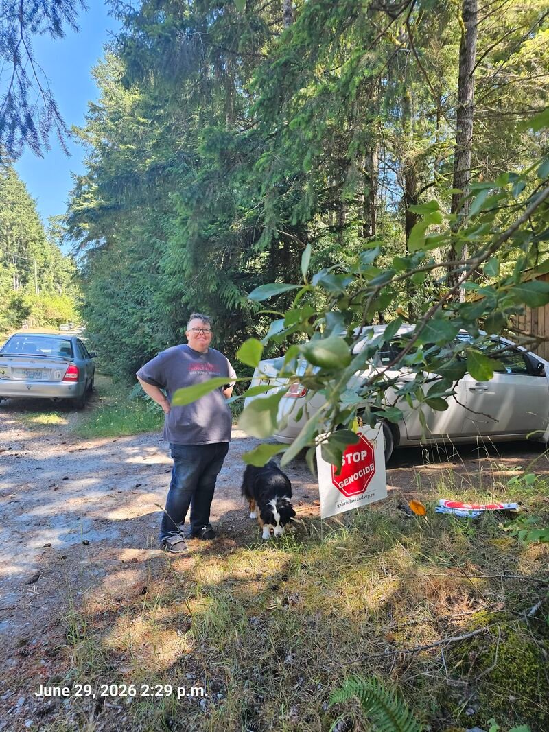 Kristina's Stop Genocide sign on Gallagher Road, Gabriola