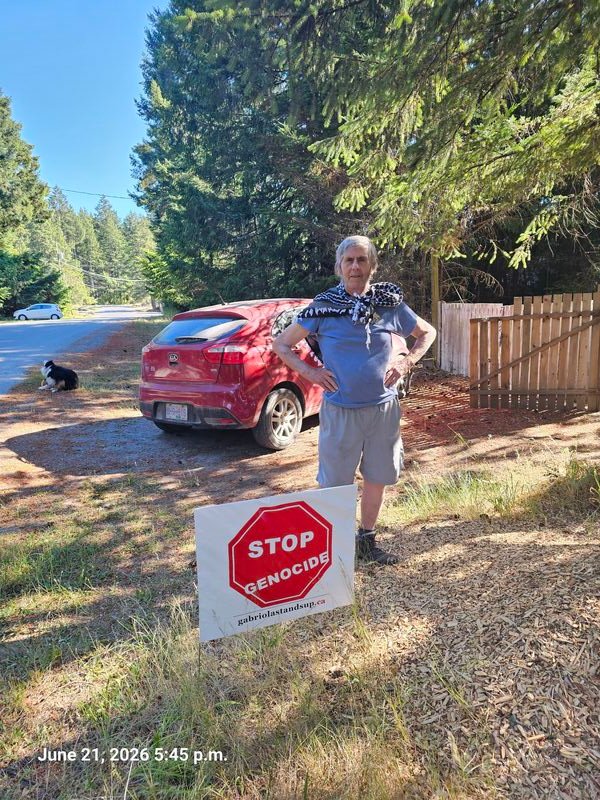 Lorne's Stop Genocide sign on Ross Way, Gabriola