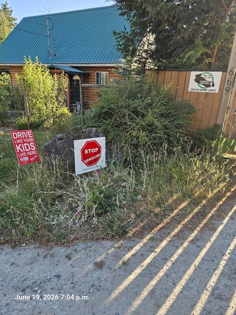 Nelson's Stop Genocide sign on Gallagher Road, Gabriola