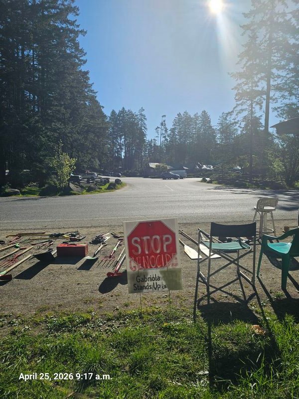 Stop Genocide sign outside Nesters Market, Gabriola Island