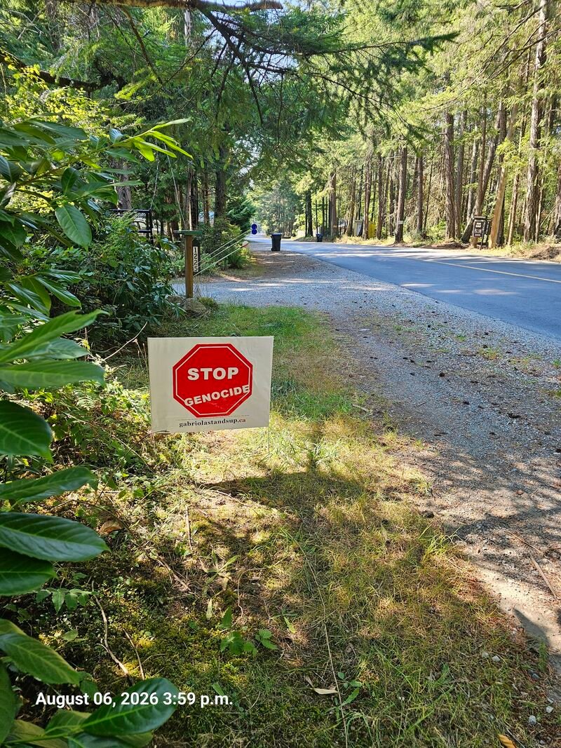 Penelope's Stop Genocide sign on North Road, Gabriola - sign #110