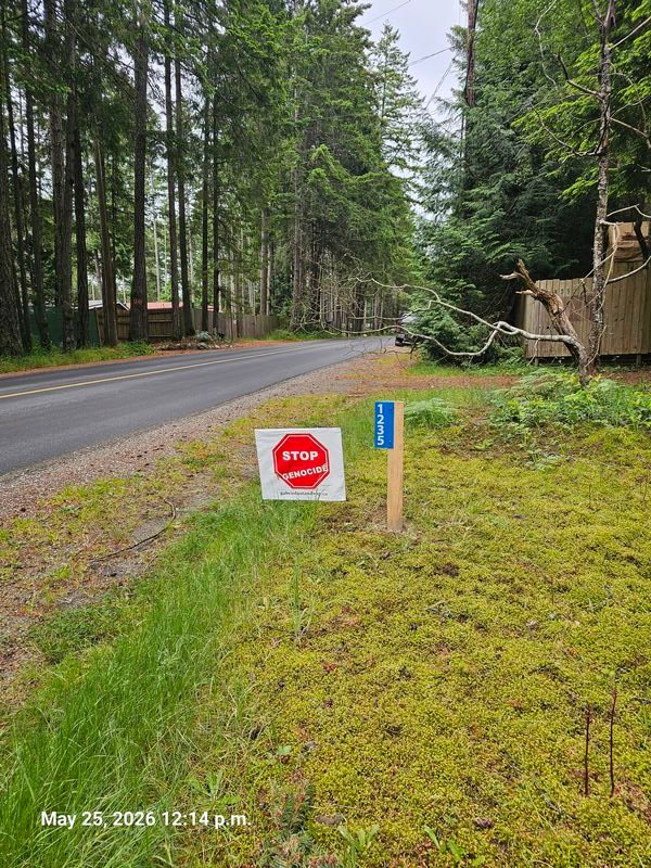 Penelope's Stop Genocide sign on North Road, Gabriola