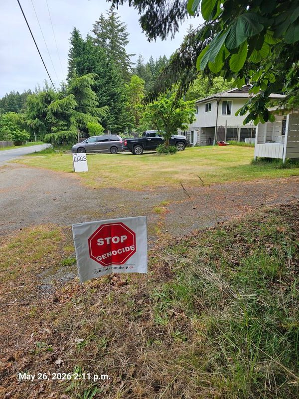 Reece's Stop Genocide sign on North Road, Gabriola