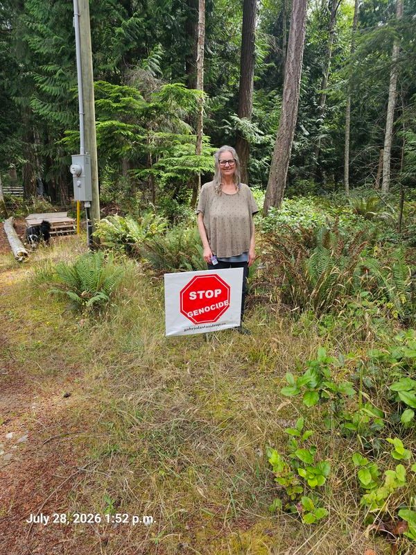 Sarah's Stop Genocide sign on Taylor Road, Gabriola