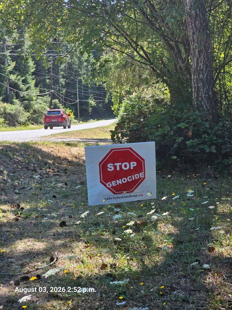Sue and Bob's Stop Genocide sign on Barrett Road, Gabriola - sign #108